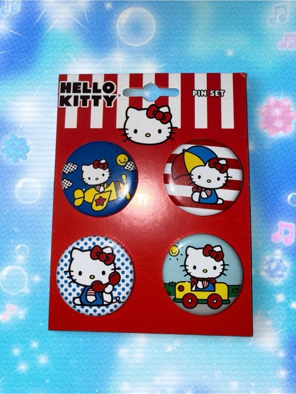 Hello Kitty pin set with 4 pins featuring Hello Kitty in different outfits